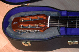 Cushioning the head of a guitar Cushioning the head of a guitar