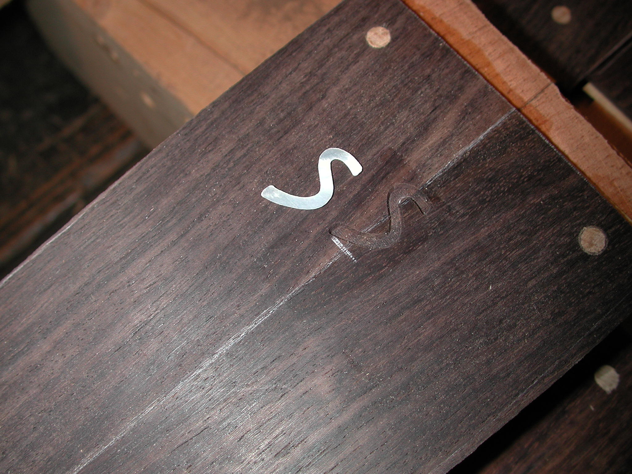 Headstock: The groove for the Mother-of-pearl Inlay Logo is milled,...
