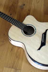 Jumbo Steel String Guitar with Extreme Cutaway, Fanned Frets, Armrest and Side Soundhole